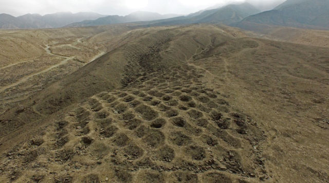 Mile-long “Band of Holes” in Peru may be remains of Inca tax system