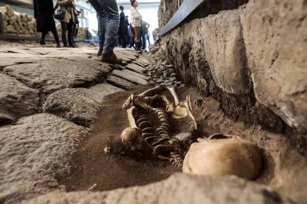 The 2000-year-old Roman road with 3 skeletons beneath a McDonald’s restaurant in Rome, Italy.