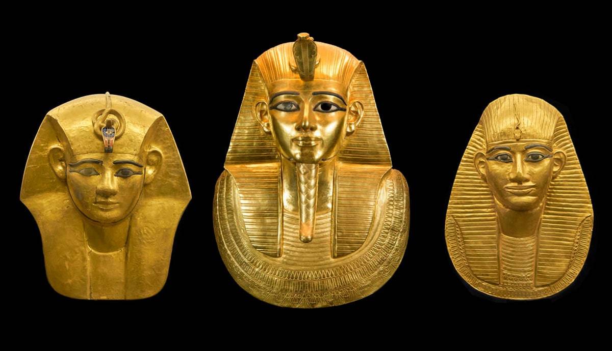 Three gold ancient Egyptian mummy masks of Pharaohs from Egypt